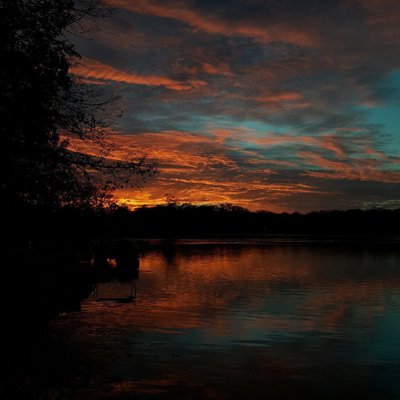 Vibrant Dramatic Sunset Mirror-like Lake Mirror-like Water Reflection Silhouette.jpg